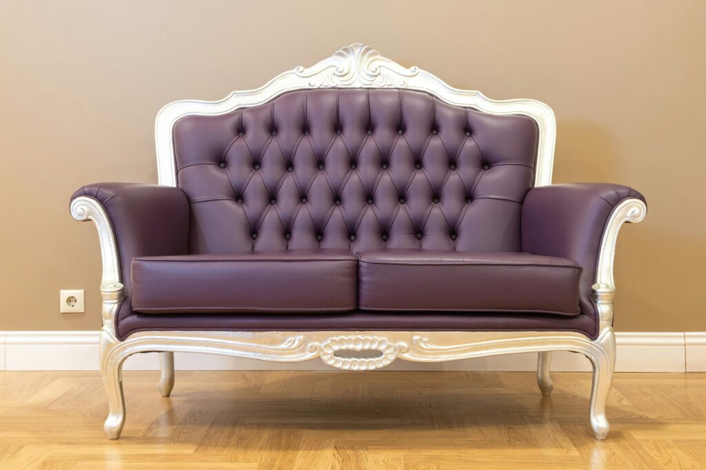 pexels-photo-8135260-8135260 Luxurious vintage leather sofa with tufted upholstery and ornate frame, ideal for classic interiors.